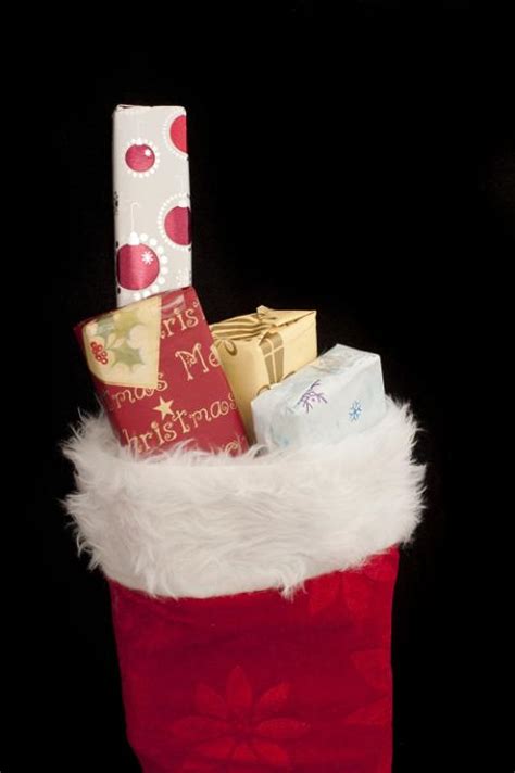 Photo of Small Christmas gifts filling a red stocking | Free christmas images