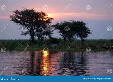 Sunset Over the Chobe River with People Camping on the Bank Stock Photo - Image of bushveld ...