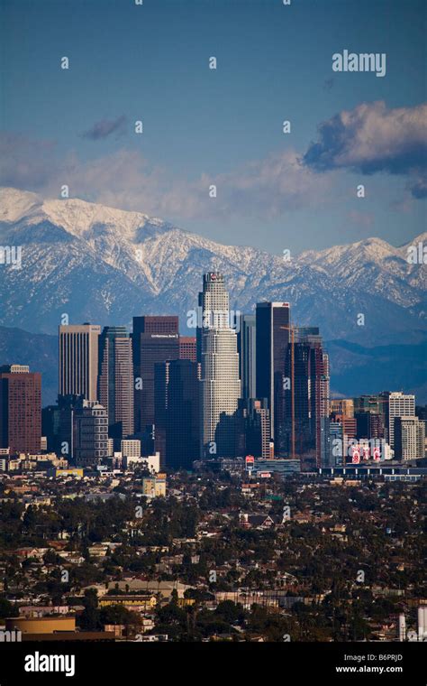 Los Angeles Skyline on a clear day with snow on mountains Los Angeles ...