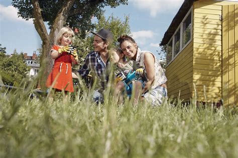 Happy family in garden stock photo