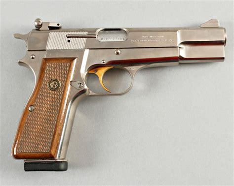 Browning Mdl Hi Power Cal 9mm SN:245PM7805Belgium made semi auto pistol, satin finish with checkere