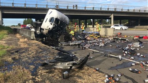 Semi-truck crash on I-5 exit ramp sends driver to hospital, spills Gatorade onto road | kgw.com