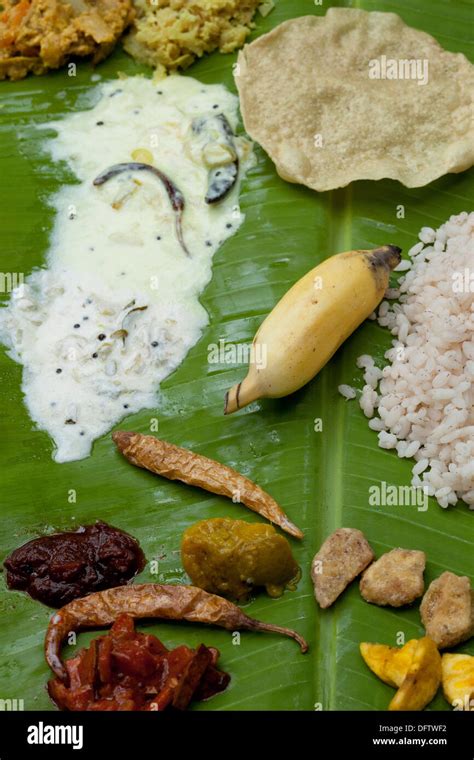 onam festival food served on banana leaf Stock Photo - Alamy