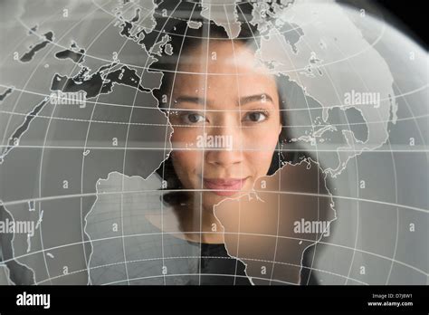 Digital portrait of young woman on world map Stock Photo - Alamy
