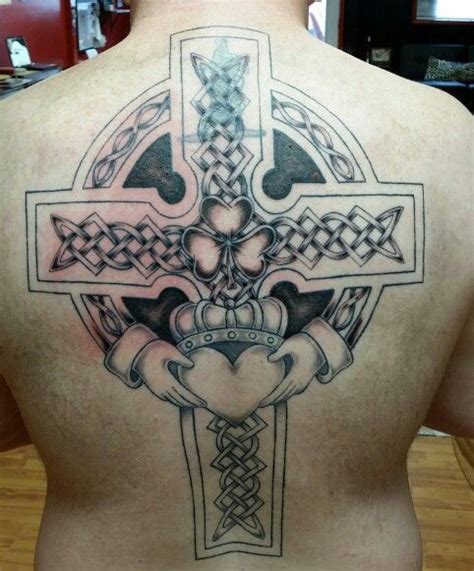 Celtic cross back tattoo in progress. More shading on Tim's piece ...