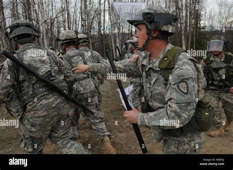 Alaska Army National Guard Soldiers assist Anchorage police to calm or detain rioters as part of ...