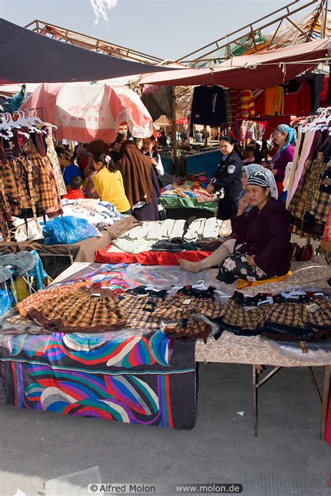 Photo of Clothes vendor. Downtown market, Kashgar, Xinjiang, China