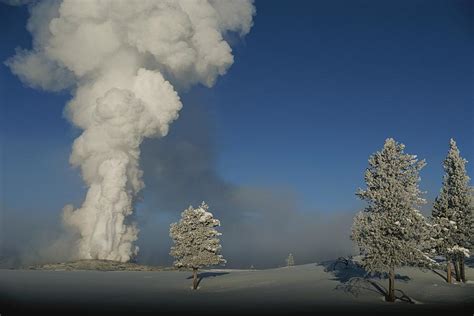 Winter View Of Old Faithful Geyser by Norbert Rosing