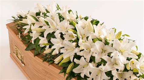 lily casket spray standard white | Flowers by Flourish