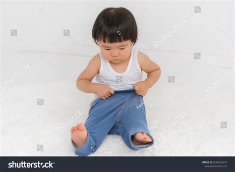 2-year-old Child Challenges Changing Clothes Stock Photo 1559335637 ...