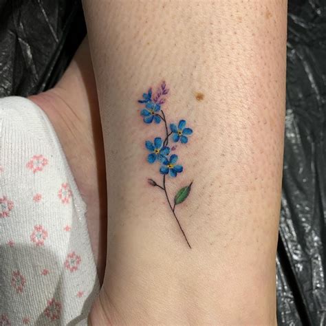 Inktales - Forget-Me-Not tattoo done by Adrian...