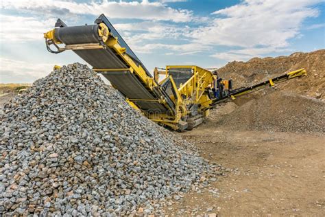 Stone Crusher Machine in a Quarry or Open-pit Mine, To Transform into Gravel Stock Photo - Image ...