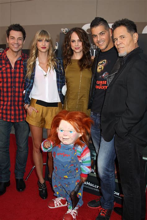 Chucky and the cast of Curse of Chucky L - R: Brennan Elliott, Maitland McConnell, Fiona Dourif ...