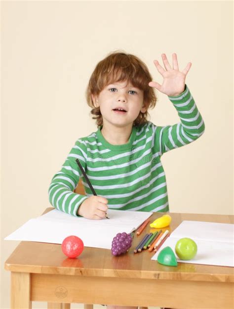 Child Raising Hand In School Stock Photo - Image: 40974422