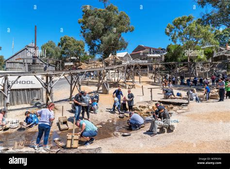 Visitors panning for gold at Sovereign Hill, an open air museum in the old gold mining town of ...