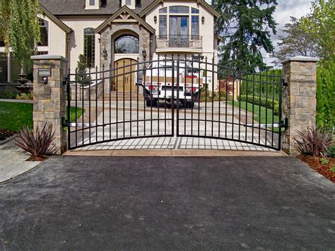 Double swing gate fabricate at an angle to account for the uphill slope. #custom #gate #security ...