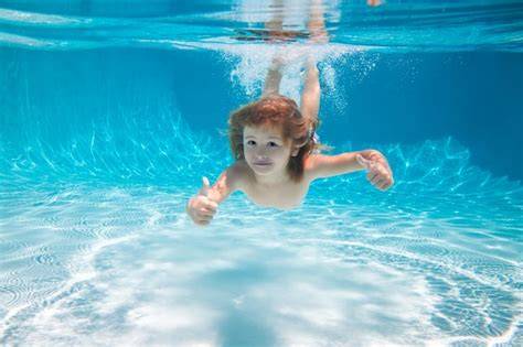 Premium Photo | Underwater kid in the swimming pool child swim and dive underwater kid with ...