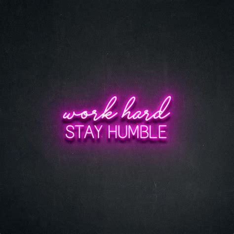 a neon sign that says work hard stay humble