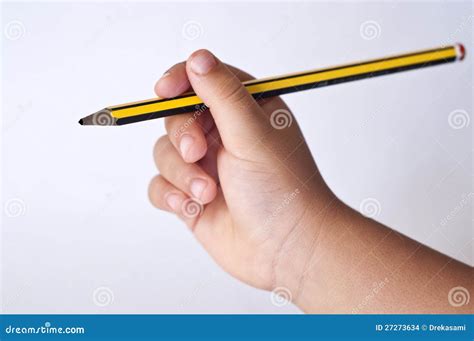 Child`s Hand Holding The Pencil Stock Images - Image: 27273634