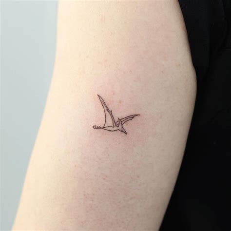 Pterodactyl tattoo done on the inner arm, minimalistic