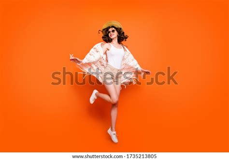 Full length photo of funny lady summer time jumping high enjoy great resort views wear stylish ...