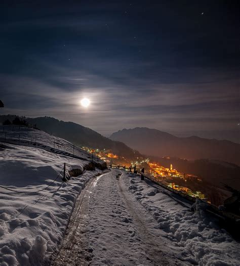 snowy mountain village at night with the moon 5249162 Stock Photo at Vecteezy