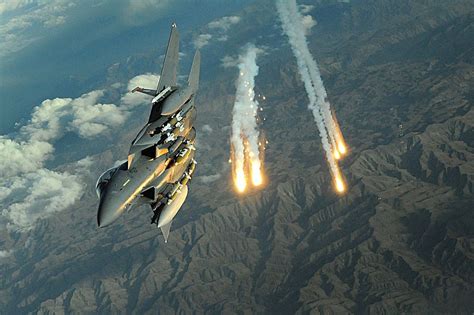 An F-15E Strike Eagle deploys flares over Afghanistan. The F-15E's ...