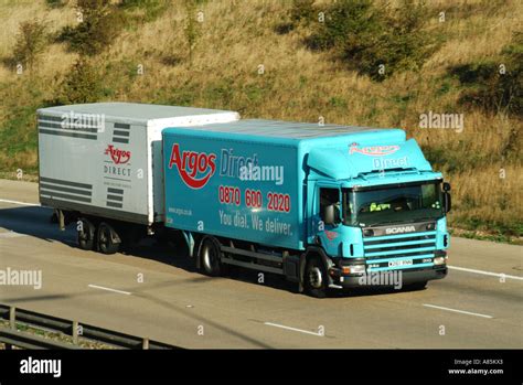 M25 motorway Argos lorry truck towing trailer Stock Photo: 6854626 - Alamy