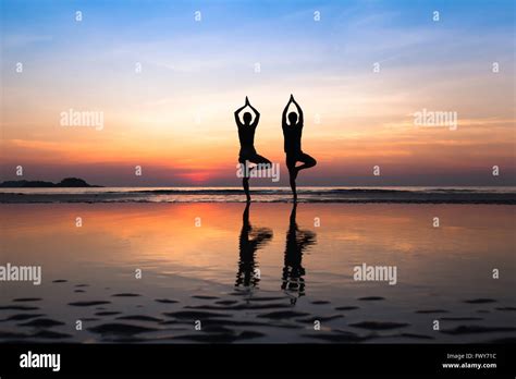 yoga on the beach, group of people practicing healthy lifestyle Stock ...