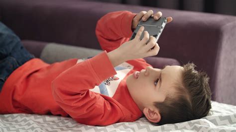 Boy Playing Mobile Game On Smartphone On Stock Footage SBV-330813982 ...