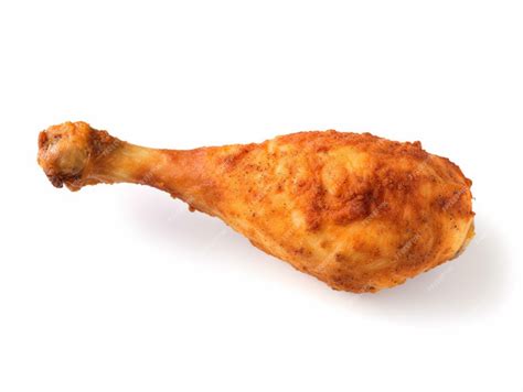 Premium Photo | A chicken leg is shown on a white background.