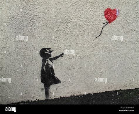 A Banksy mural of girl with red balloon on wall in Brixham Devon Stock Photo - Alamy