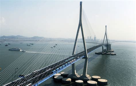 an aerial view of a large bridge over water