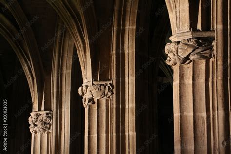 Three church stone pillars and arches in a gothic style with a ...