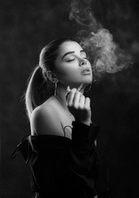 Black and White Photo of a Young Woman Smoking a Cigarette · Free Stock ...