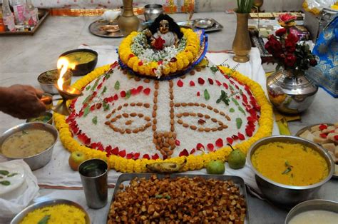 : Kolkata :Hindu devotees perform prayers with varieties of food to the Idol of Goddess Gopal ...