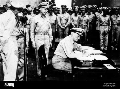 World War II, Admiral Nimitz signing Japanese surrender document aboard ...