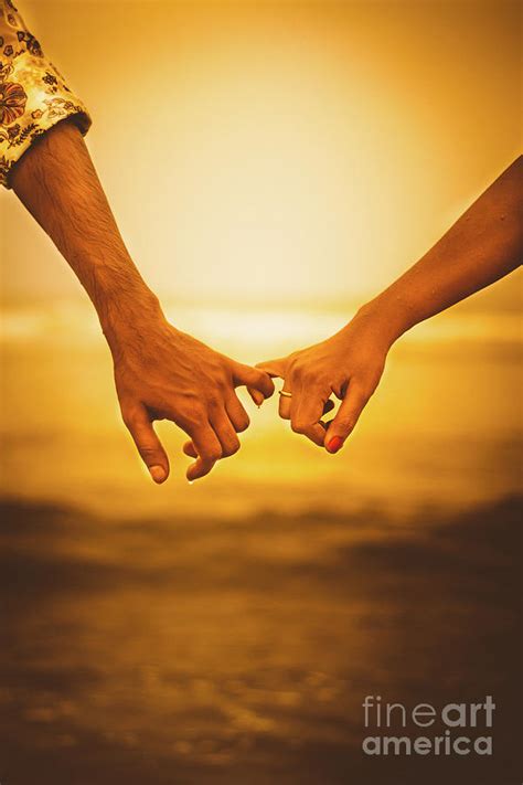 Couple Holding Hands At Sunset, India by Teju Nookala