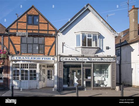 shops on cranleigh village high street surrey Stock Photo - Alamy