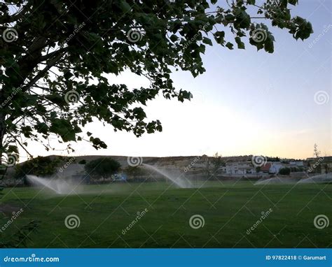 Golf Course with Sprinklers Stock Photo - Image of grass, golf: 97822418