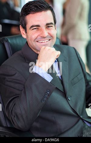Middle-aged businessman sitting in small private jet plane Stock Photo - Alamy