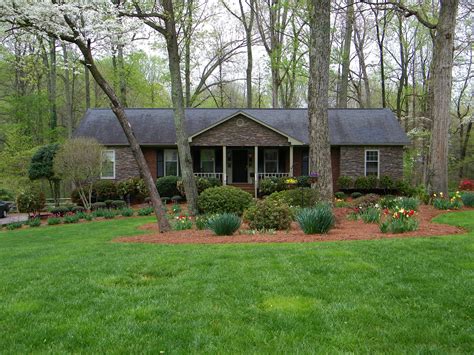 mulch .... 50s red brick rancher update with stone | Ranch house ...