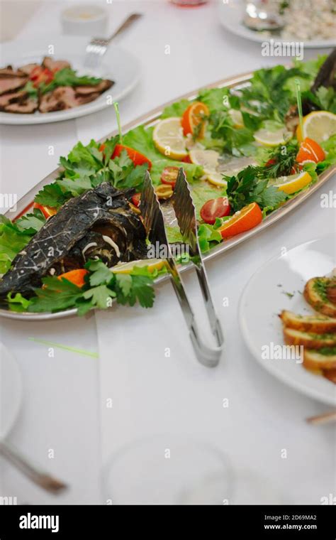 Big fish on table during catering event. Catering buffet Stock Photo ...