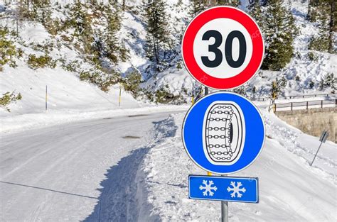 Road Signs on a Snowy Mountain Road Stock Photo by ©Alpegor6 122052706