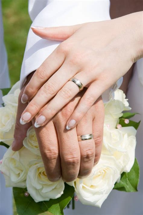 Holding Hands With Wedding Rings Stock Photo - Image: 21499150