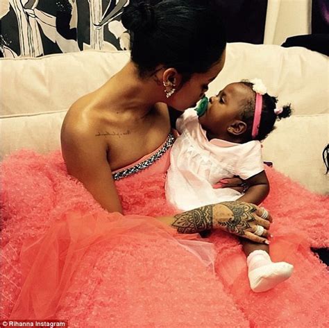 Rihanna shares sweet photo cuddling up to baby cousin Majesty on her ...