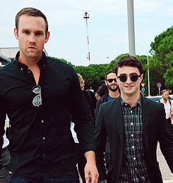 Damn right they're horns, Daniel Radcliffe and his bodyguard Sam.