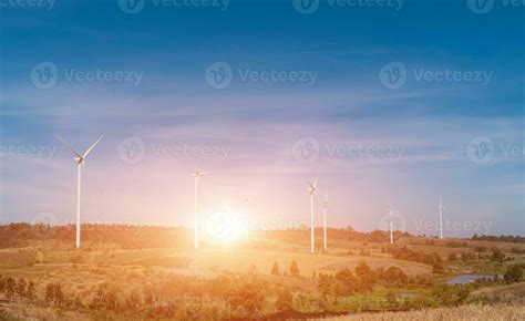 Wind turbine field with blue sky background at sunset. 26428506 Stock Photo at Vecteezy