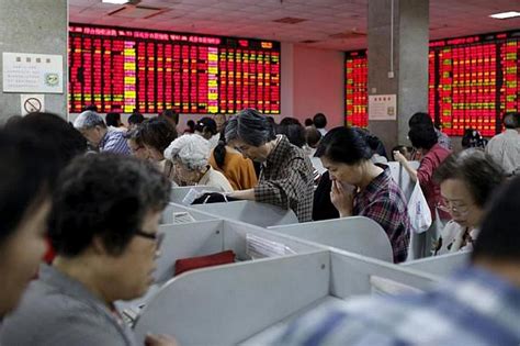 China stocks volatile in morning trade after surprise rate cuts | The ...