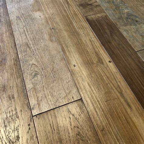 Reclaimed teak wide plank flooring with natural patina. Each floor board is glass rubbed to ...